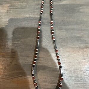 26 inch necklace in grays , golds and silvers